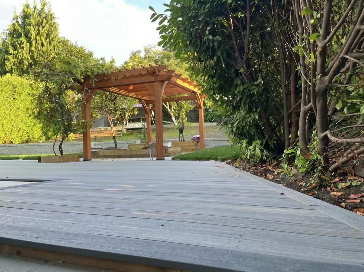 Wooden pergola over composite deck