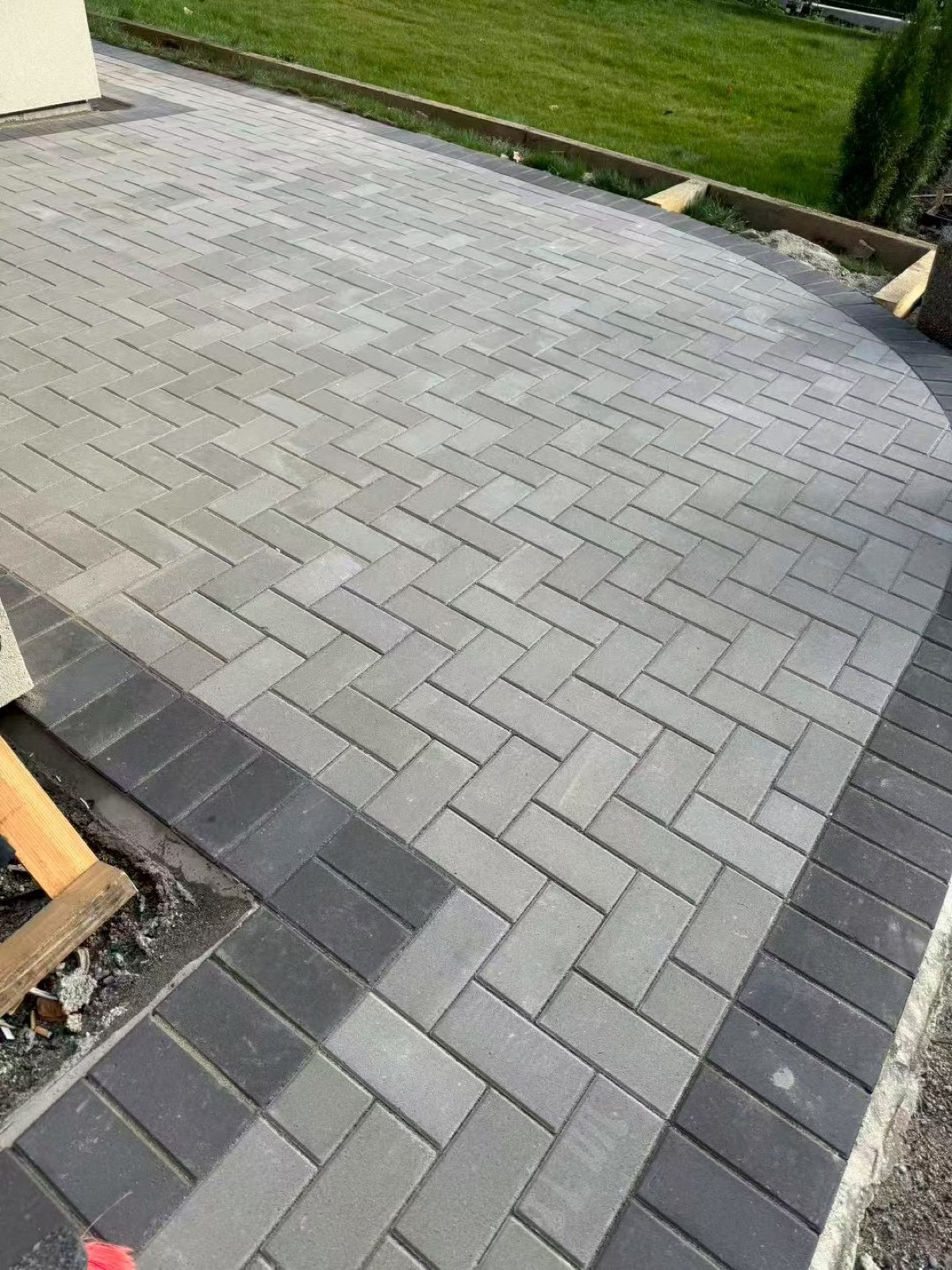 Putting green with concrete patio in forest setting