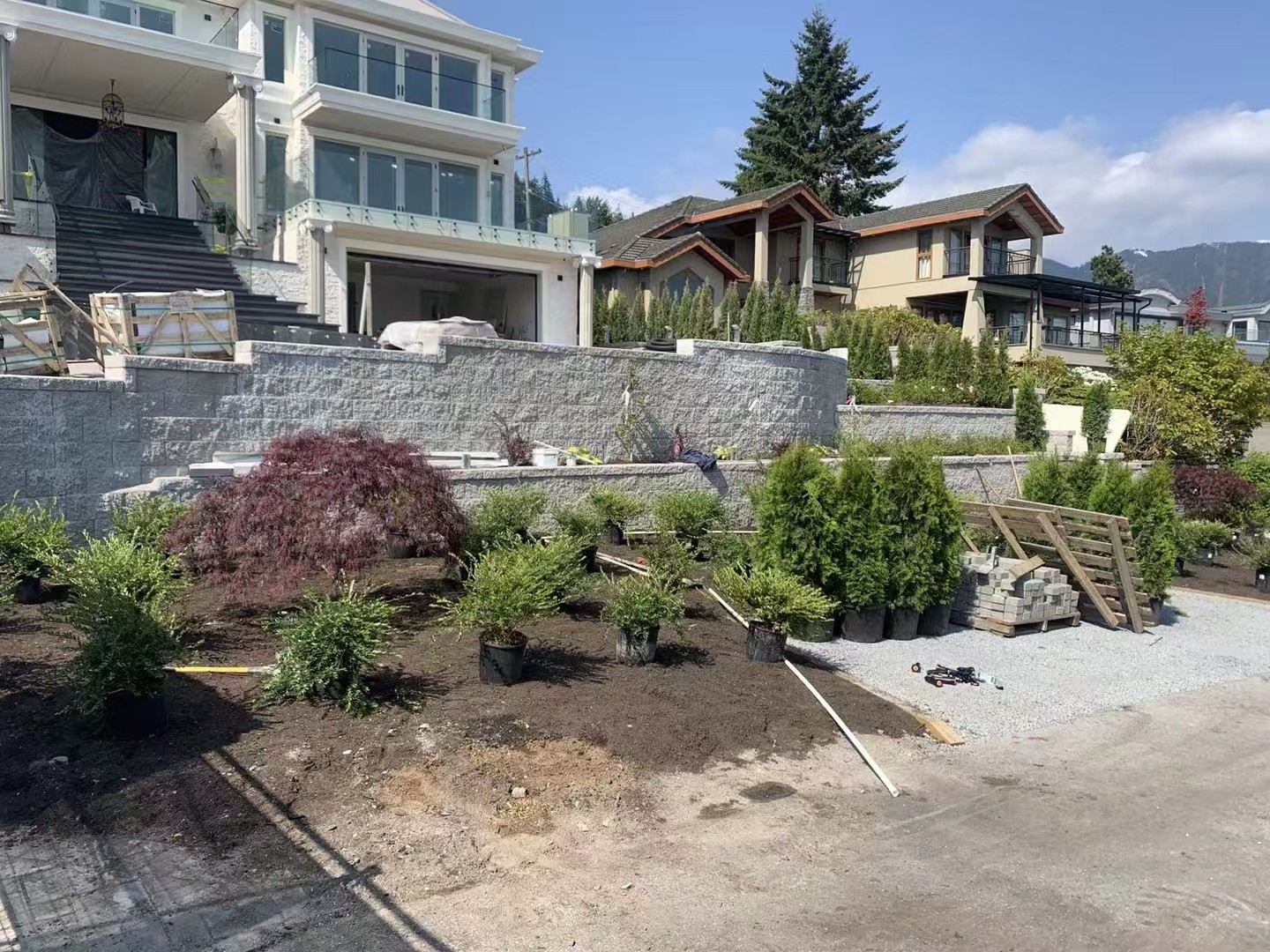 Large retaining wall with fresh plantings at luxury home